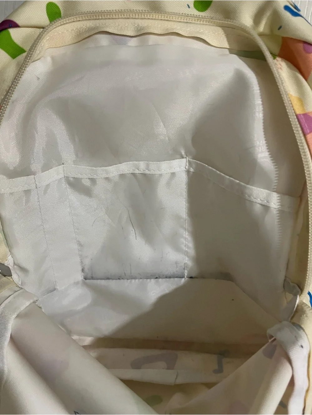 Jansport Cream Backpack with Multicolor Geometric Print